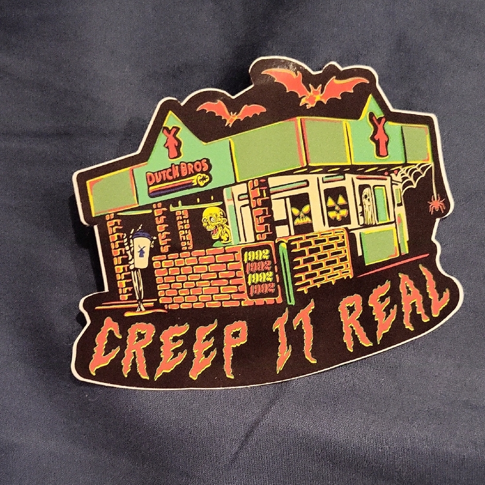 Dutch Bros Spooky Sticker with Green and Orange